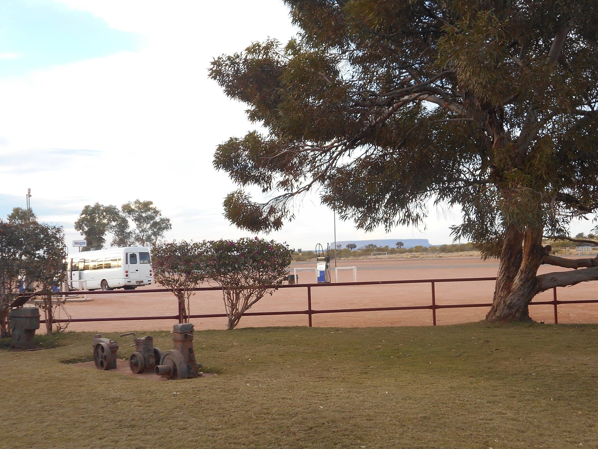 Open inland country and fence lines towards Mount Conner at Curtin Springs, Northern Territory